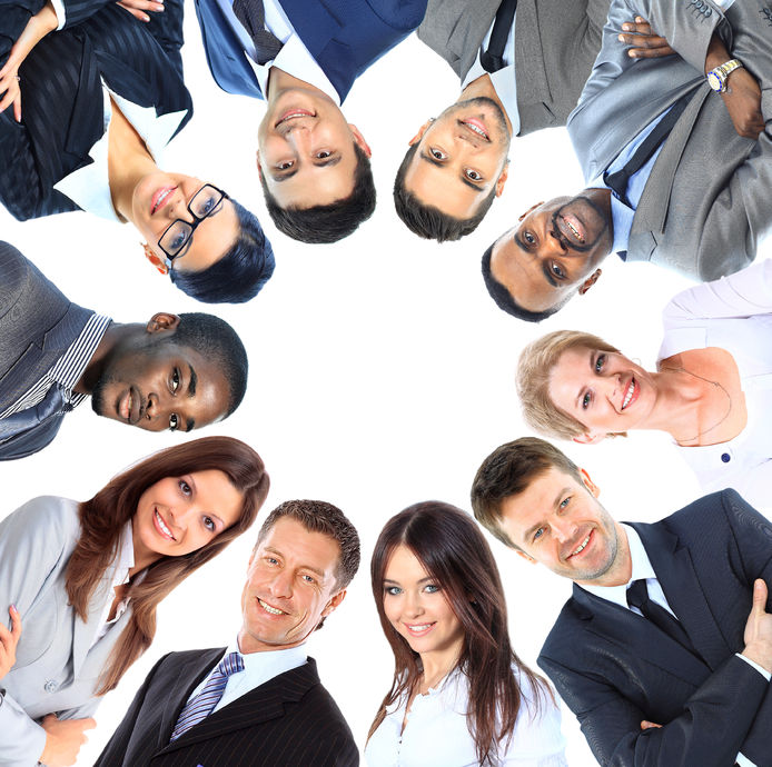 Group of business people standing in huddle