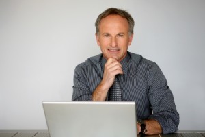13881524 - businessman using a laptop computer