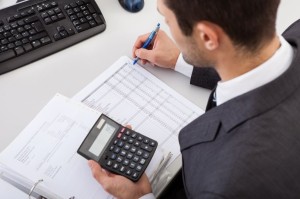 14929635 - successful accountant working with financial data in the office