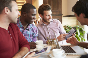 31021240 - group of male friends meeting in café restaurant