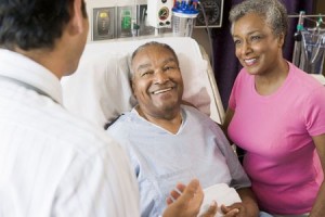 3724718 - senior couple talking,smiling with doctor