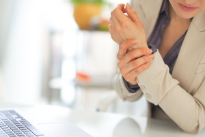 28095240 - closeup on business woman with wrist pain