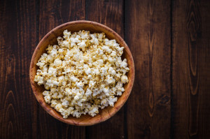 38553665 - spiced popcorn in a wooden bowl on a table in the living room