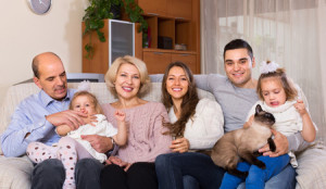 40829854 - portrait of big happy multigenerational family on sofa at home