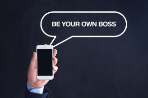 65643998 - hand holding smartphone with be your own boss written speech bubble