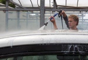 10097582 - man washing his car with a high pressure water jet