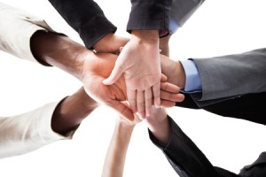 21254099 - low angle view of multiracial people stacking hands over each other