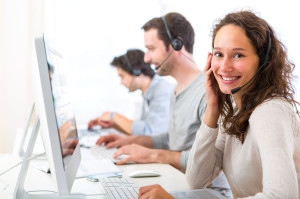 32314063 - view of a young attractive woman working in a call center