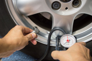 43596066 - hand and car wheel add air pressure