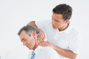 25503652 - male chiropractor massaging patients neck over white background