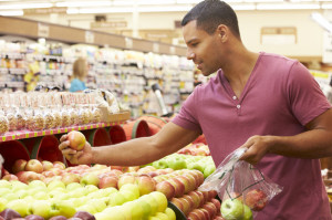 42271014 - man at fruit counter in supermarket