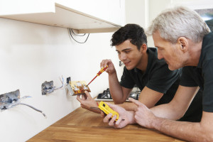 51080105 - electrician with apprentice working in new home