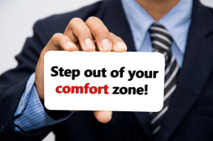 38884428 - businessman hand holding step out of your comfort zone! concept