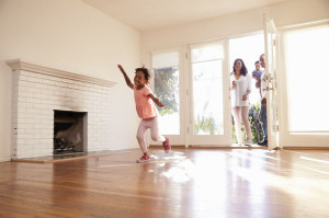 71273286 - excited family explore new home on moving day