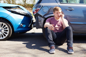 28154941 - driver making phone call after traffic accident