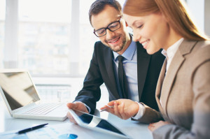 29855966 - young businesswoman explaining report to her colleague at meeting