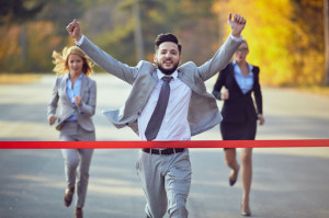 37750677 - businessman reaching finish line