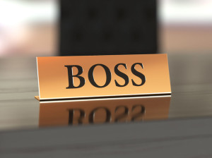 51539050 - golden nameplate with boss text on the wooden table, with soft focus
