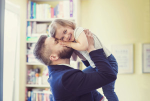 39720486 - young father hugging his daughter as he gets home from work