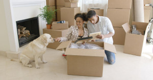 71837124 - young woman petting her pet dog