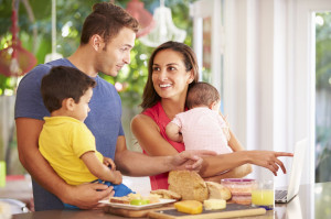 33539571 - mother making snack for family in kitchen