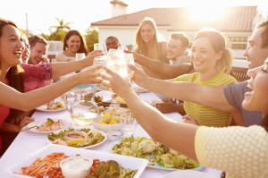 33545703 - group of young people enjoying outdoor summer meal