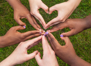 84628364 - black and white hands in heart shape, interracial friendship concept