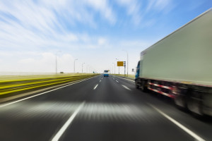 45791754 - truck on a fast express road, motion blur