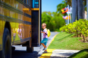 55857853 - cute kid are getting on the bus, ready to go to school