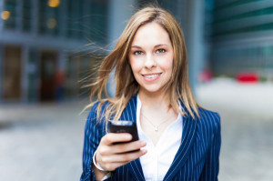 22208318 - portrait of a woman using a cell phone