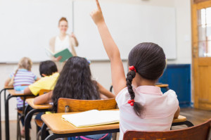 38077859 - pupil raising hand in classroom at the elementary school