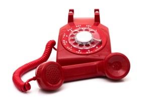 7633227 - a red retro telephone isolated on white, call for help