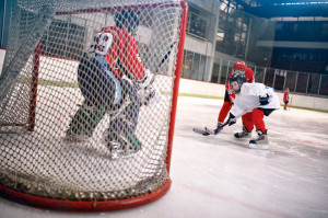 hockey goals, shoots the puck and attacks goalkeeper