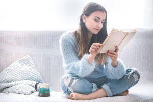 girl on the couch reading a book