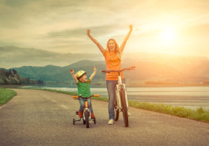 45868719 - happiness mother and son on the bicycles funning outdoor