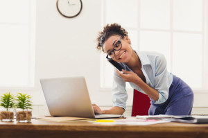 Business talk, woman consulting by phone at office