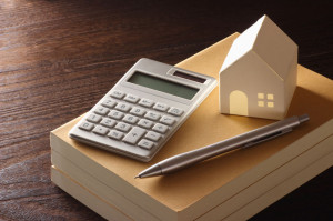 41812137 - toy house and calculator on the table