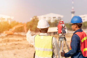 Construction engineer with foreman worker checking construction