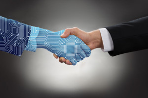 Digital Generated Human Hand And Business Man Shaking Hands
