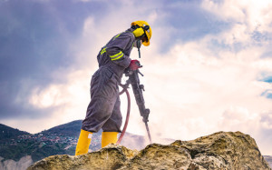 Worker on top of a rock