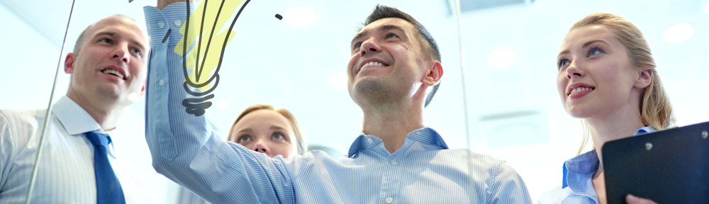 smiling business people with marker and stickers