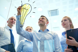 smiling business people with marker and stickers