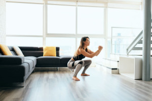 Adult Woman Training Legs Doing In and Out Squat