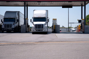 Semi Trucks are at the gas station for refueling