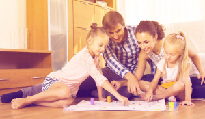 Parents playing with kids at home