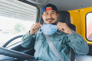 Truck driver wearing a mask