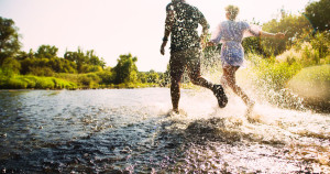 30821241 - happy couple running in shallow water. summertime.