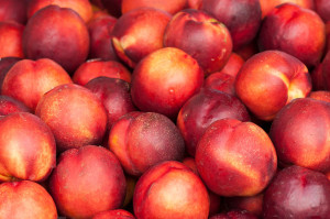 closeup of nectarines peaches at the market.