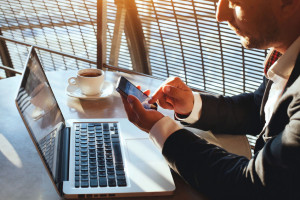 business man using internet on  smart phone and laptop