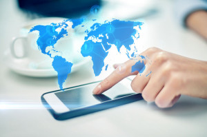 close up of woman hand with smartphone and map